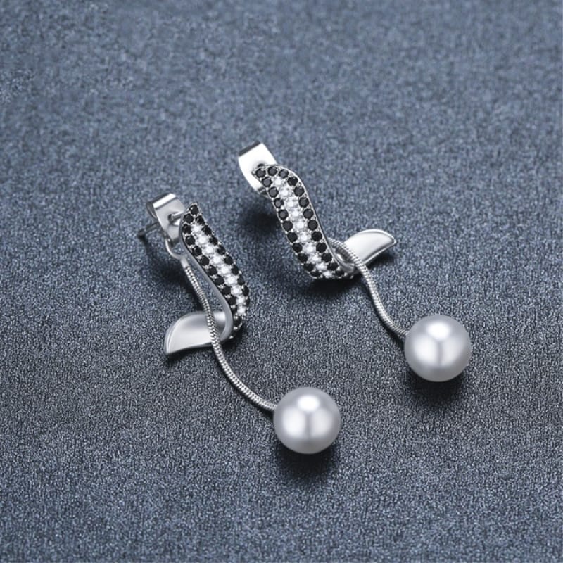 Pearl pendant tassel earrings, view 1